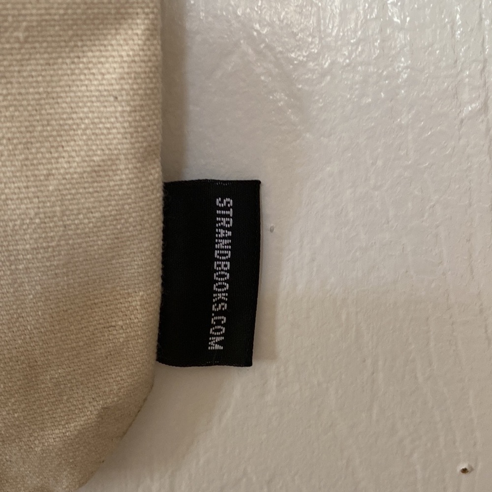 The Strand Icon RBG Time is one the side of CHANGE Tote Bag - Picture 8 of 10